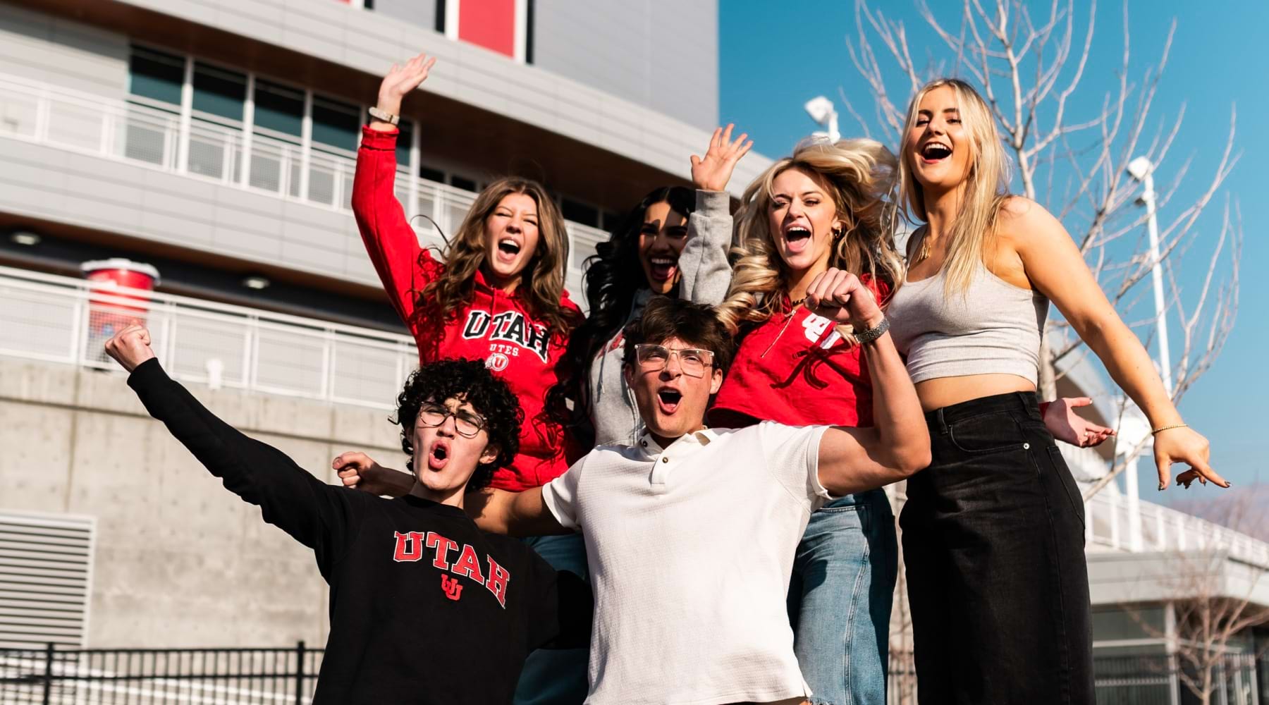 a group of students in front of the University of Utah