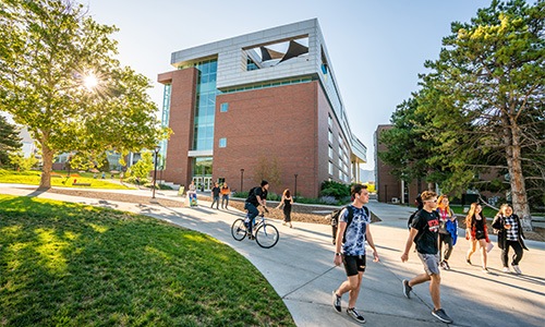 people walking on a sidewalk